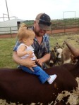 Matt and Gentry Moffat on BWS Domino a 2012 bull calf out of Miss Tammy Faye.  It is never to early to get them hooked ont he cows.