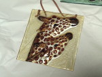 Painted glass giraffe tile.