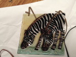 Painted glass zebra tile.